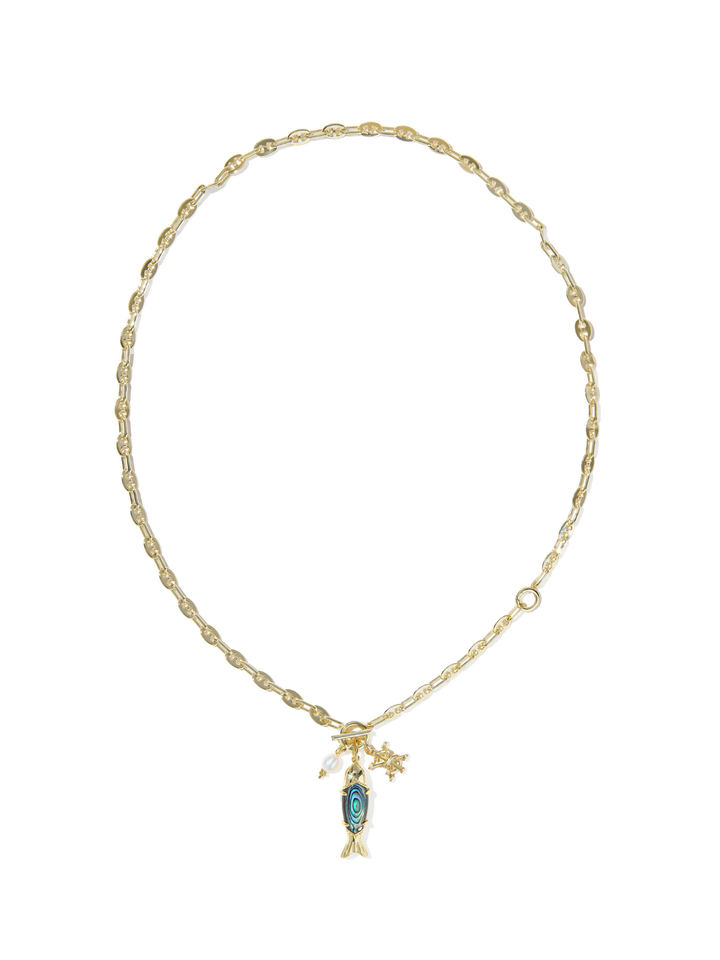 A delicate gold chain necklace featuring a small fish pendant with a blue-green stone and a small star charm, displayed on a clean white background.