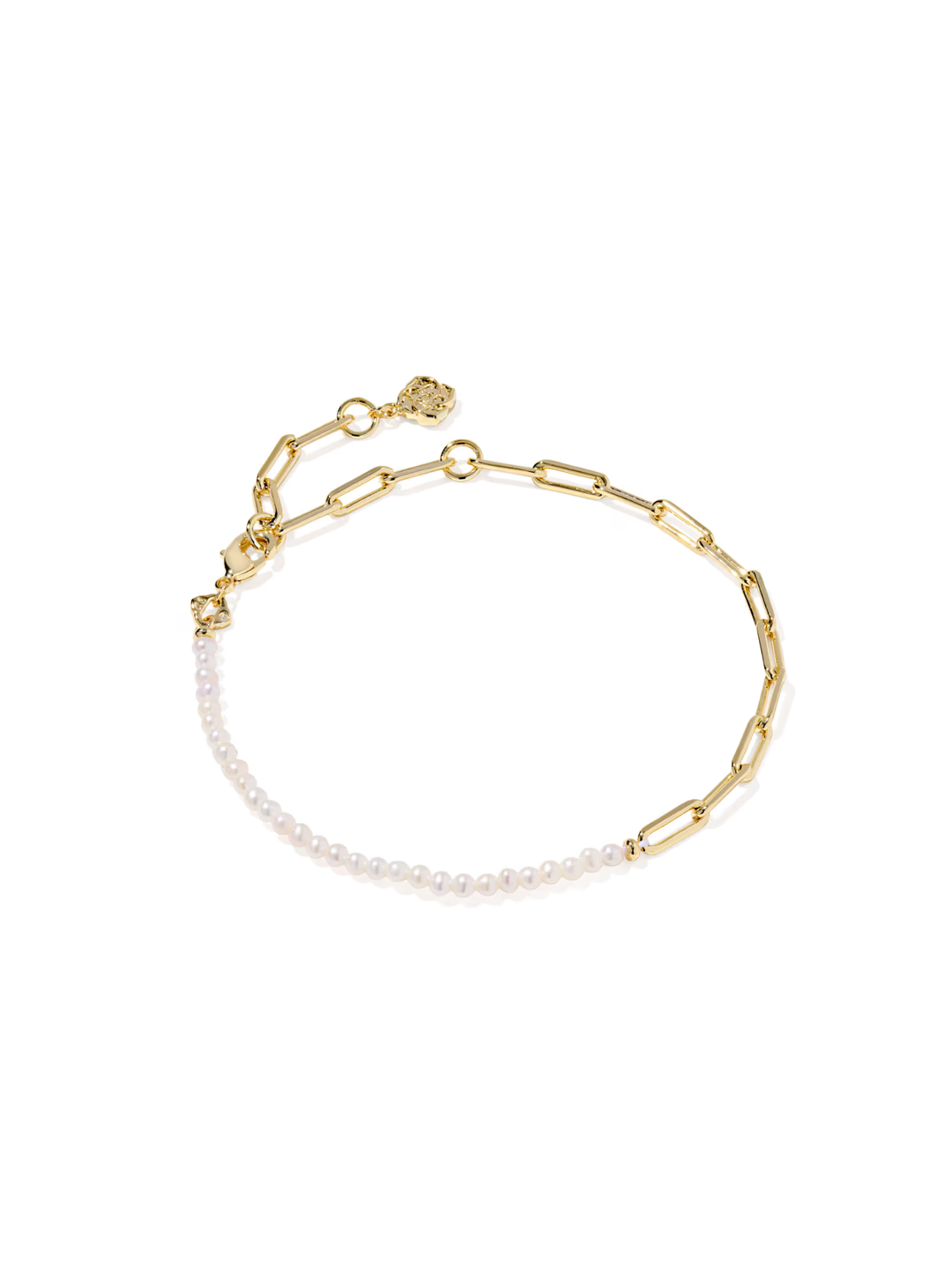 Gold chain bracelet with white beads on a white background