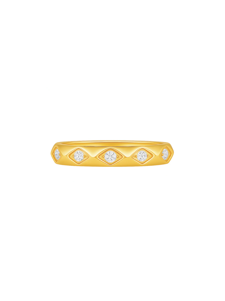 Gold ring with diamond accents on a white background
