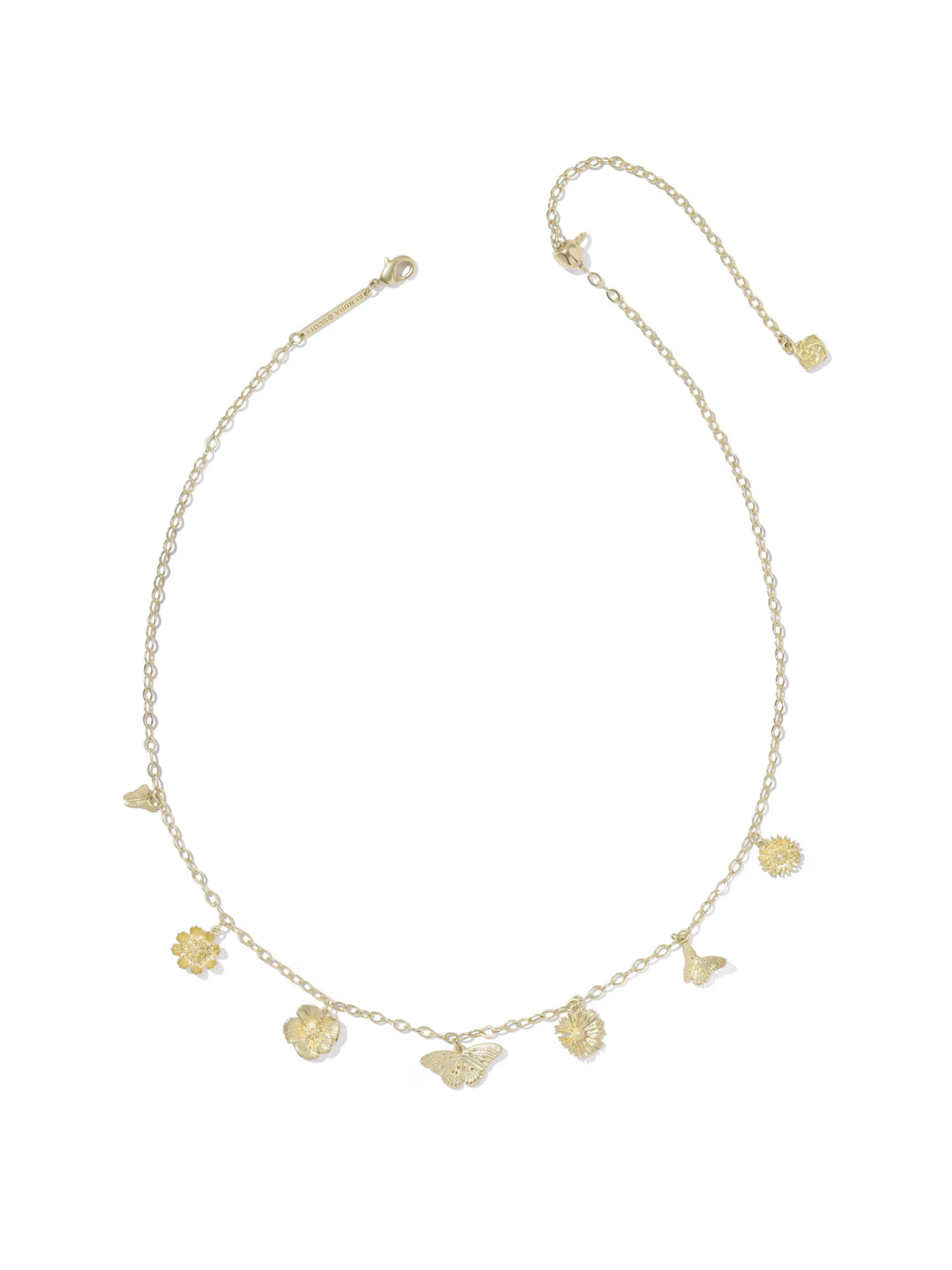 Gold necklace with various charms on a white background