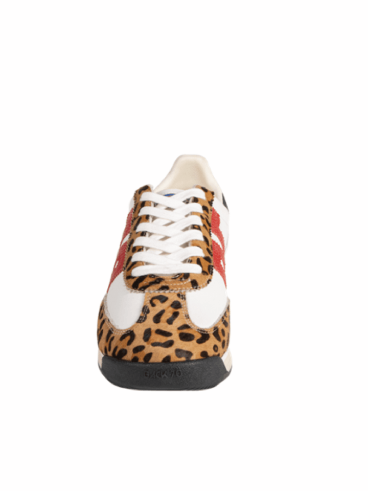 A low-top sneaker shown from the back, featuring a leopard print pattern on the toe and heel, white leather side panels, white laces, and a black sole.