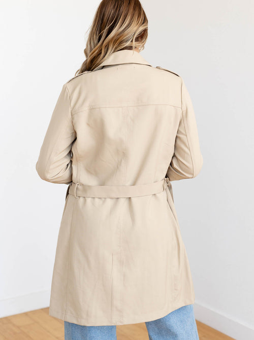 tan belted trench coat