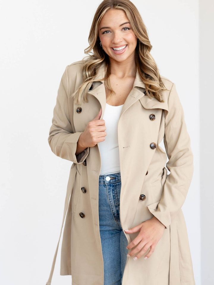 tan belted trench coat