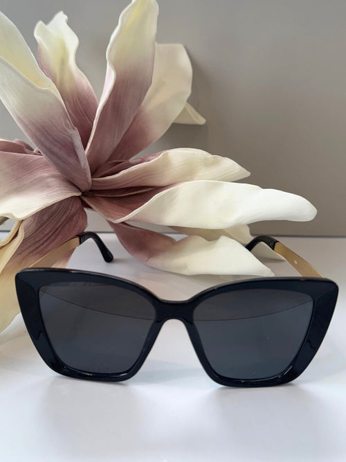 black and gold oversized sunglasses
