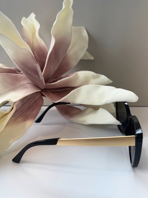 black and gold oversized sunglasses