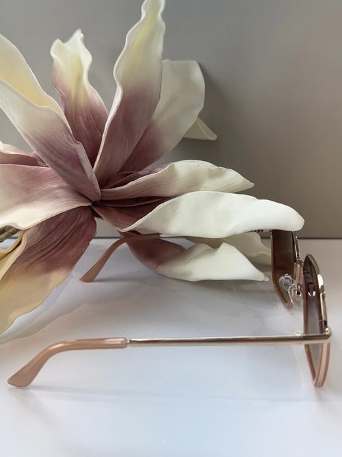 faded brown retro oversized sunglasses