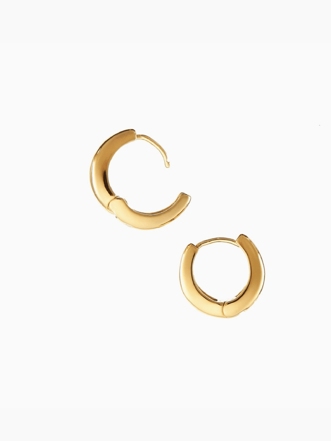 Gold hoop earrings on a white background