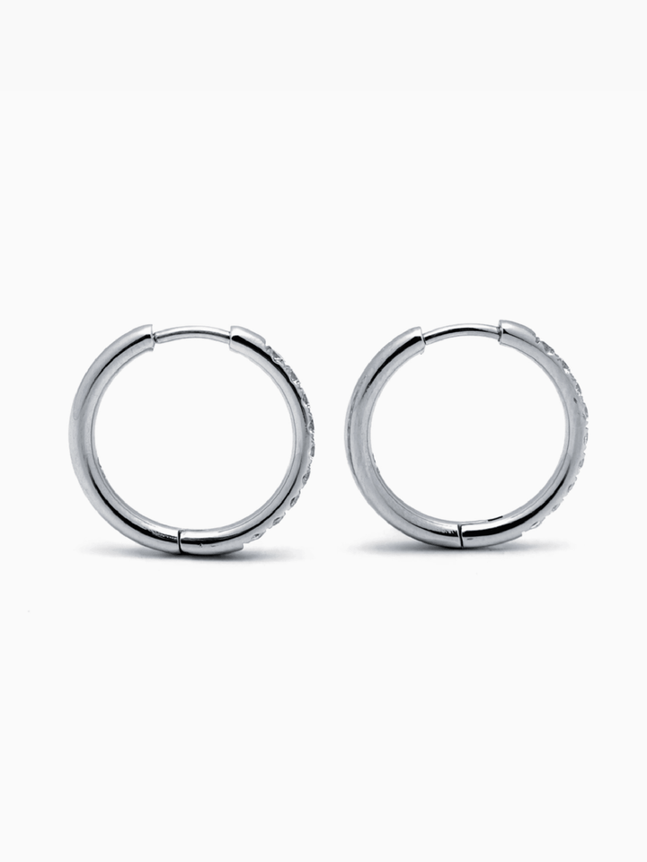 Pair of silver hoop earrings on a white background