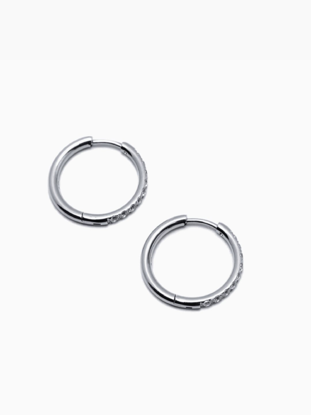 Pair of silver hoop earrings on a white background