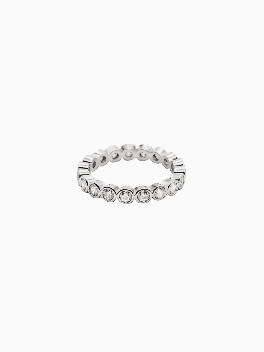 Silver ring with embedded crystals on a white background