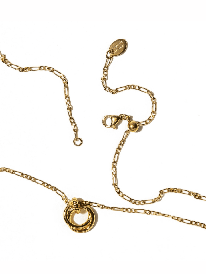 Gold chain necklace with a double-ring pendant, shown on a clean white background with close-up views of the clasp and extender chain.