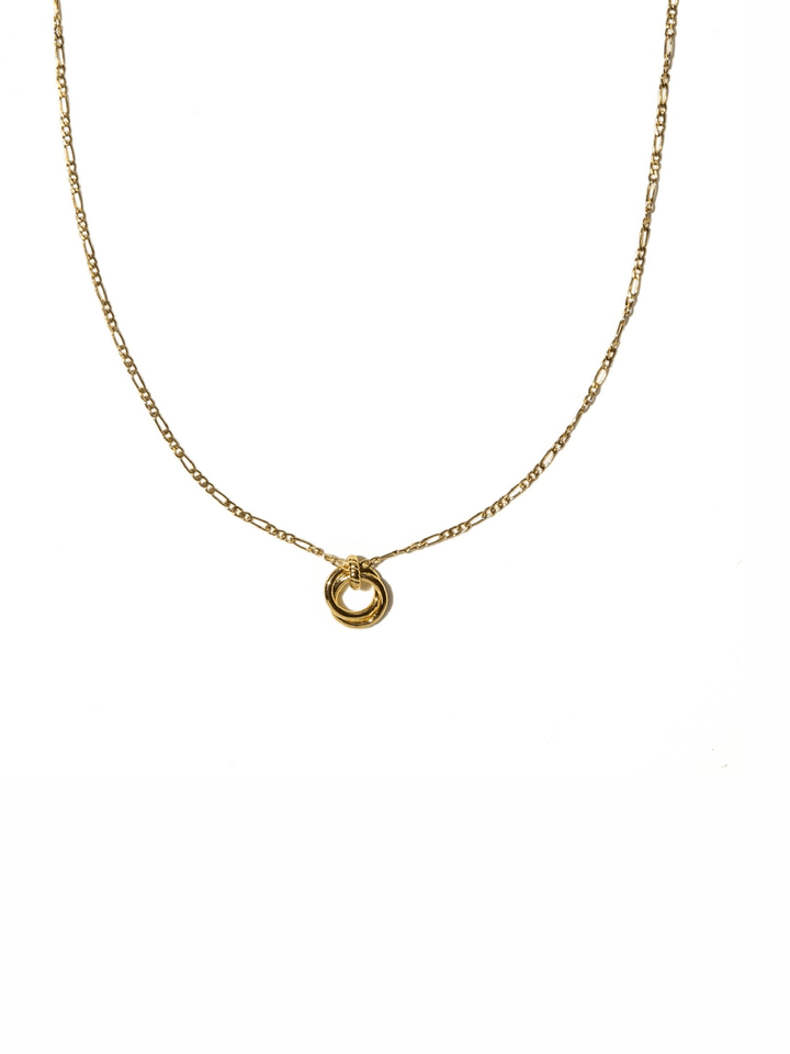 A delicate gold chain necklace featuring a small, polished gold ring pendant, displayed against a solid white background.