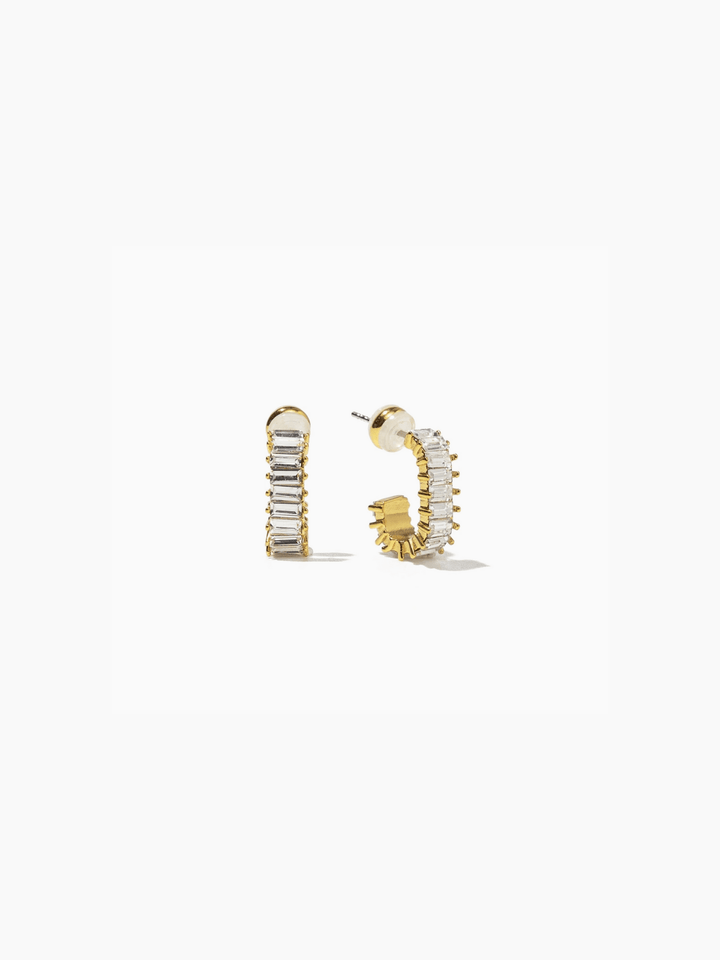 Gold hoop earrings with embedded stones on a white background