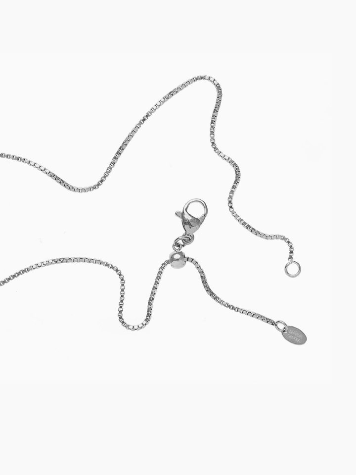 Silver necklace with clasp on a white background