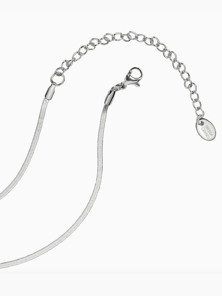 Silver chain necklace on a white background