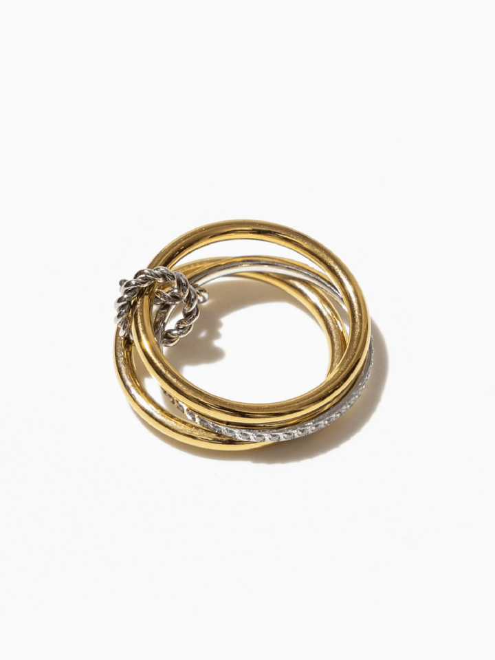Set of gold and silver rings on a white background