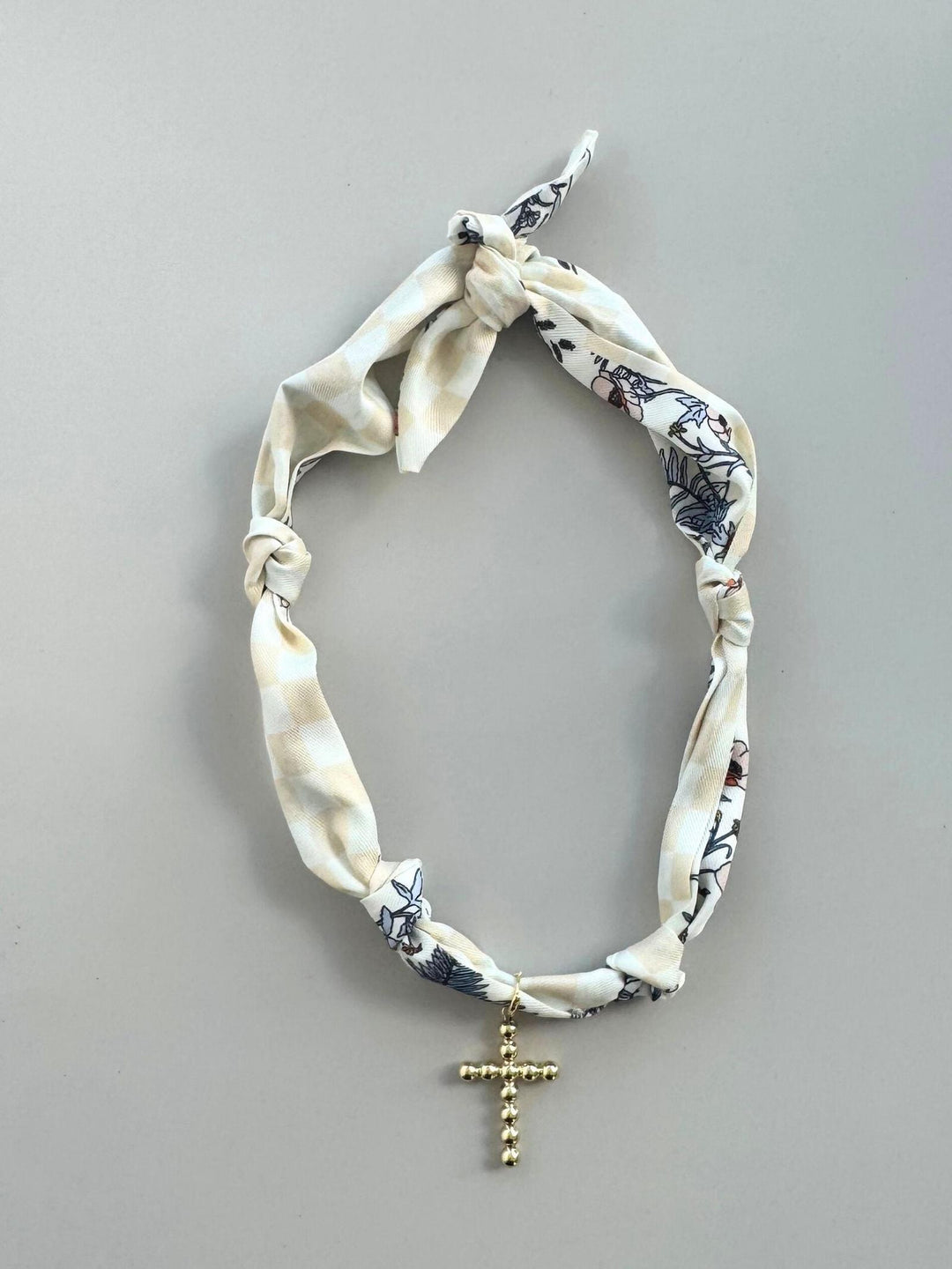 cream cross necklace