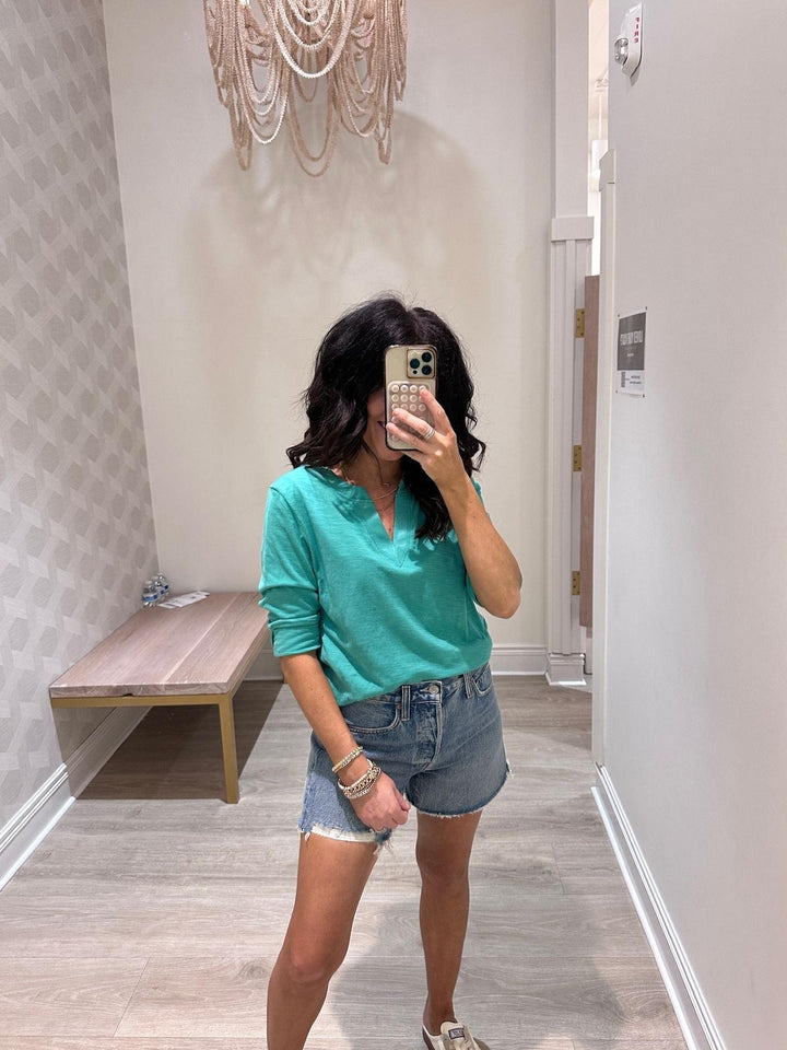 green v-neck top
