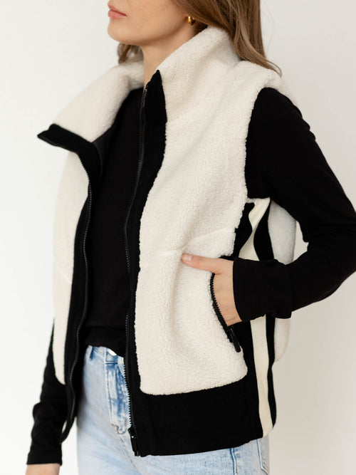 white and black sherpa vest