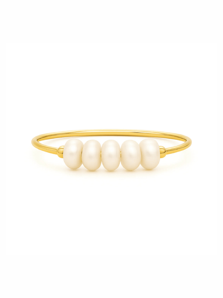 Gold bracelet with pearls on a white background