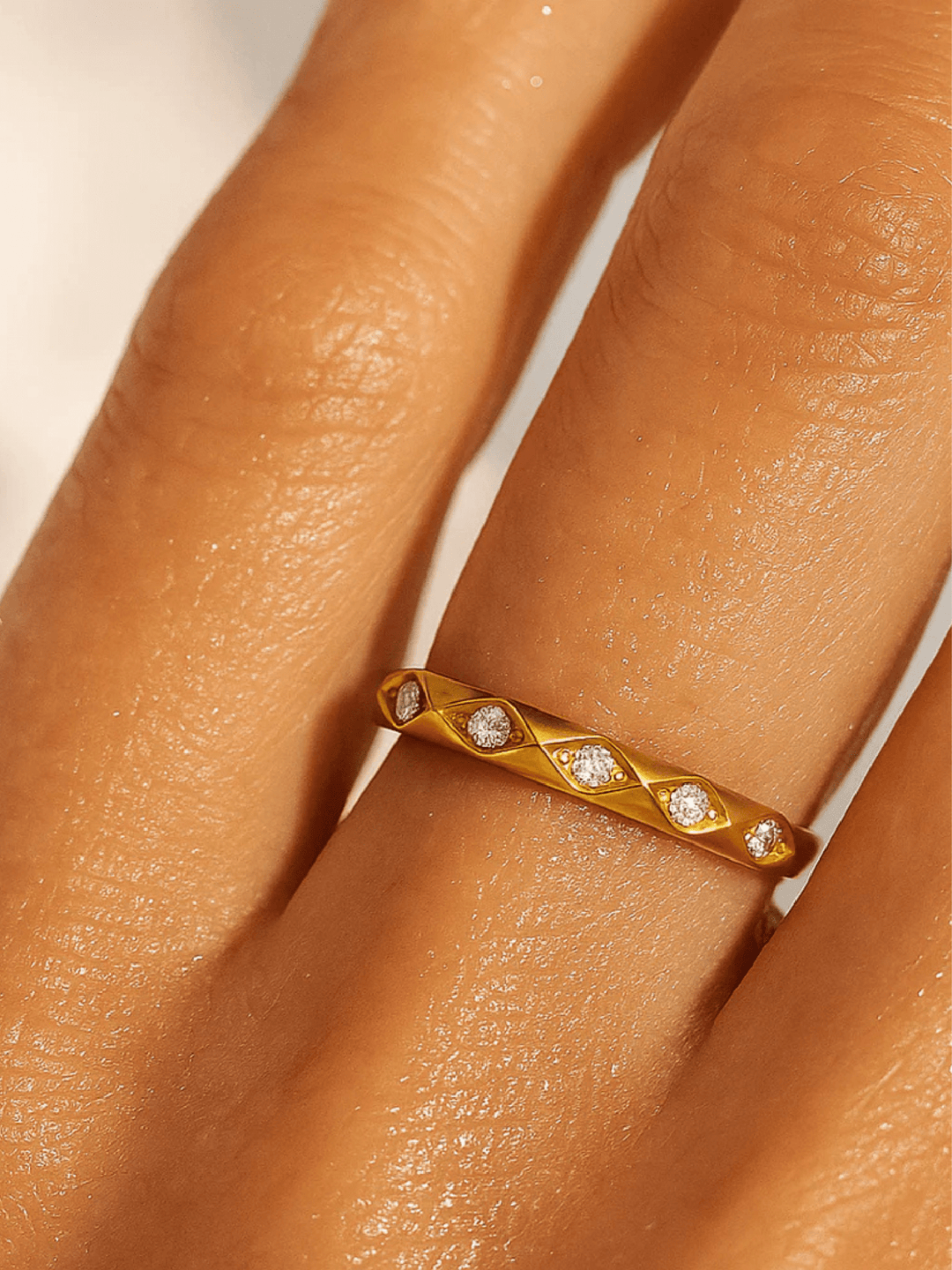 Gold ring with diamonds on a person&