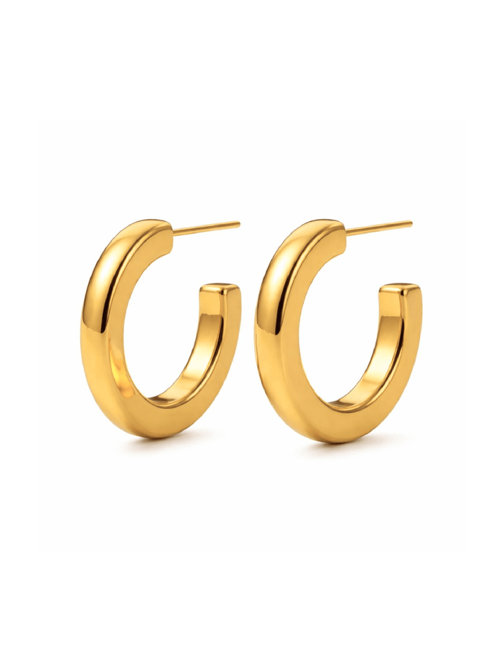 Gold hoop earrings on a white background