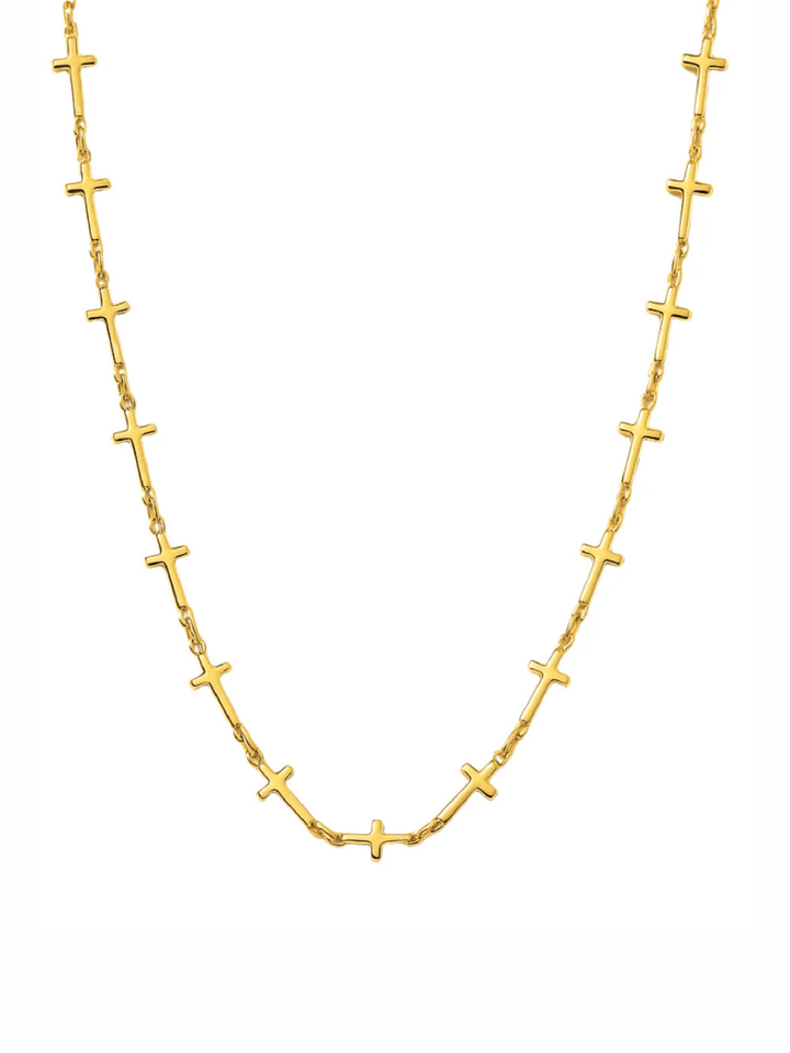 Gold necklace with cross pendants on a white background