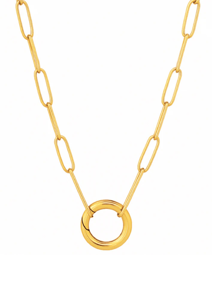 Gold necklace with a unique ring pendant on a white background