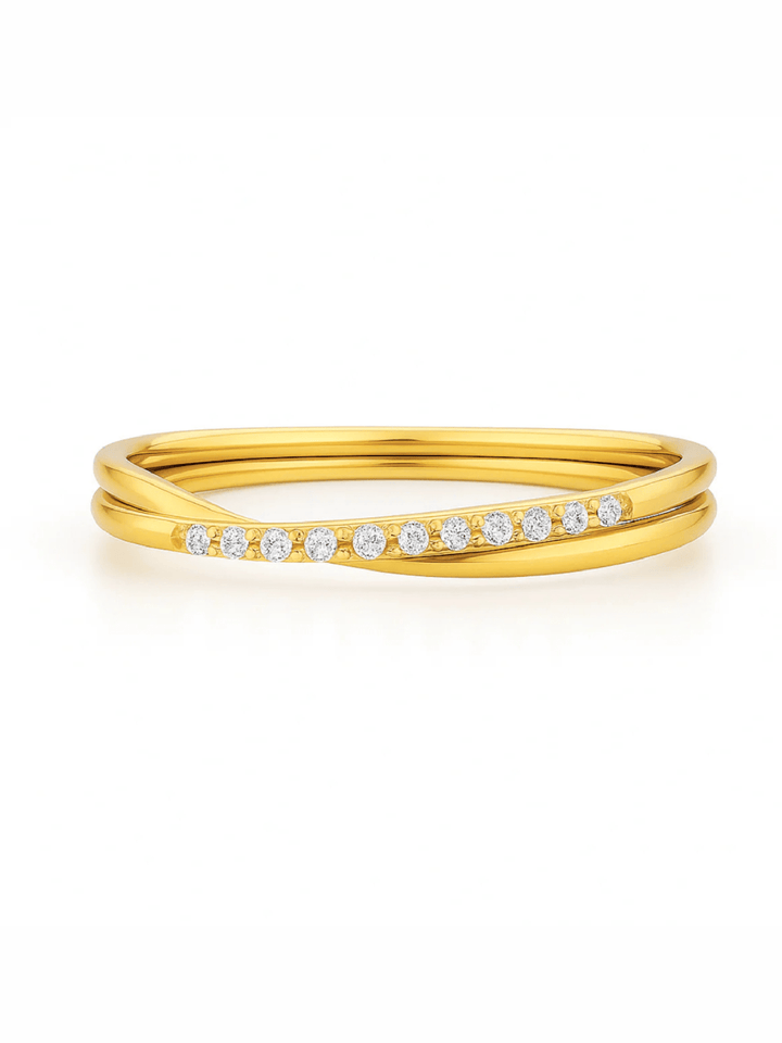 Gold ring with small diamonds on a white background