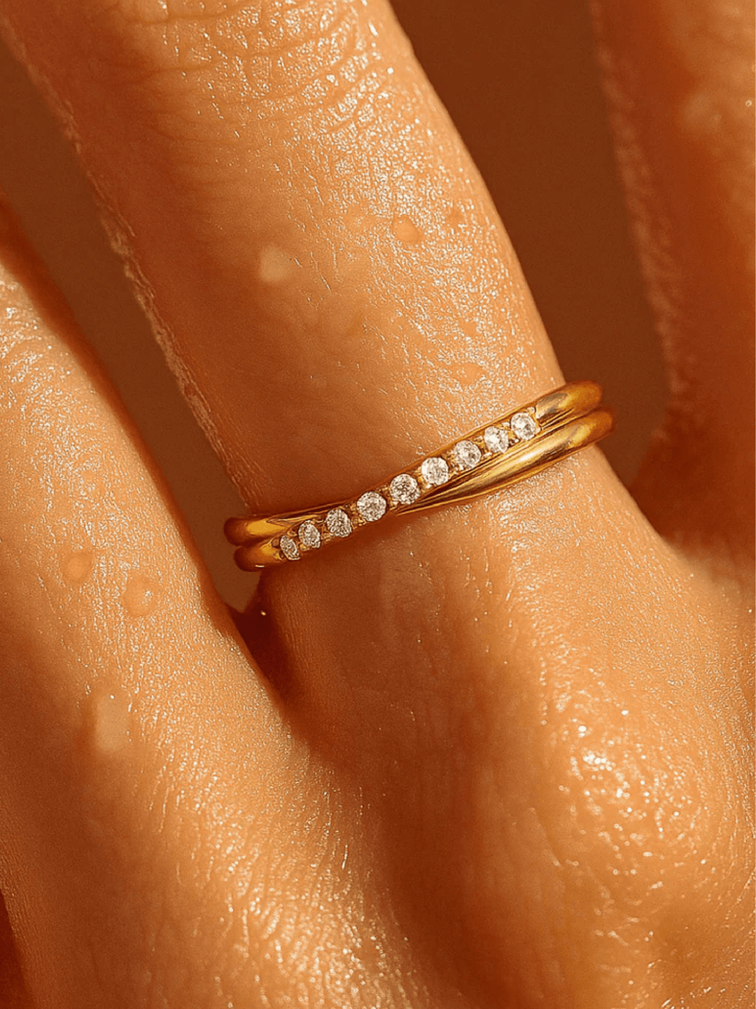 Gold ring with small diamonds on a person&