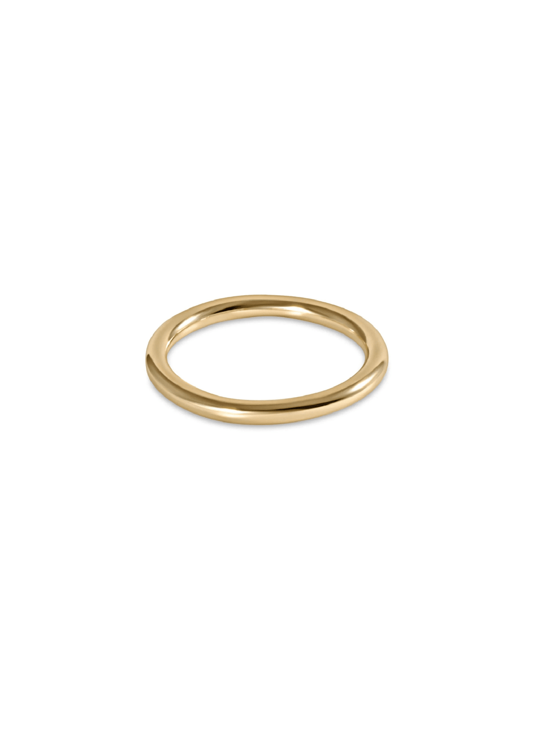 A minimalist, polished gold-plated metal ring with a flat, circular band, shown on a clean white background.