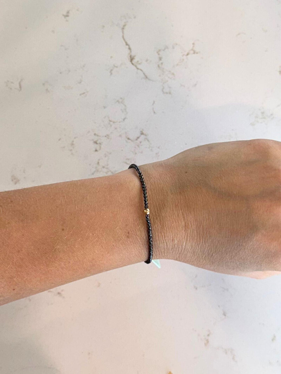 grey beaded bracelet