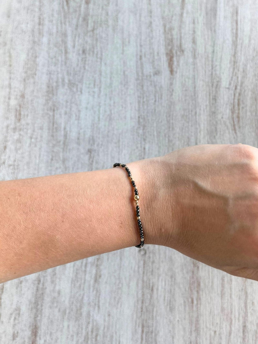dark grey and gold bracelet