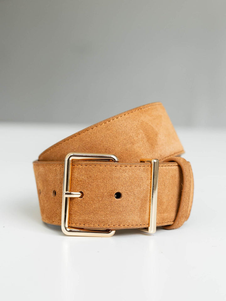 Almond suede belt with a modern angular gold buckle and streamlined silhouette.