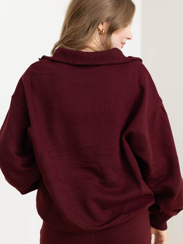 dark wine colored half zip sweatshirt