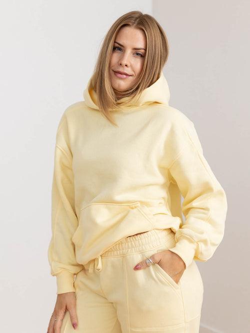 relaxed yellow hooded sweatshirt