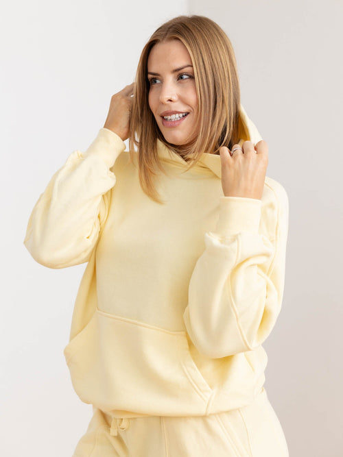 relaxed yellow hooded sweatshirt