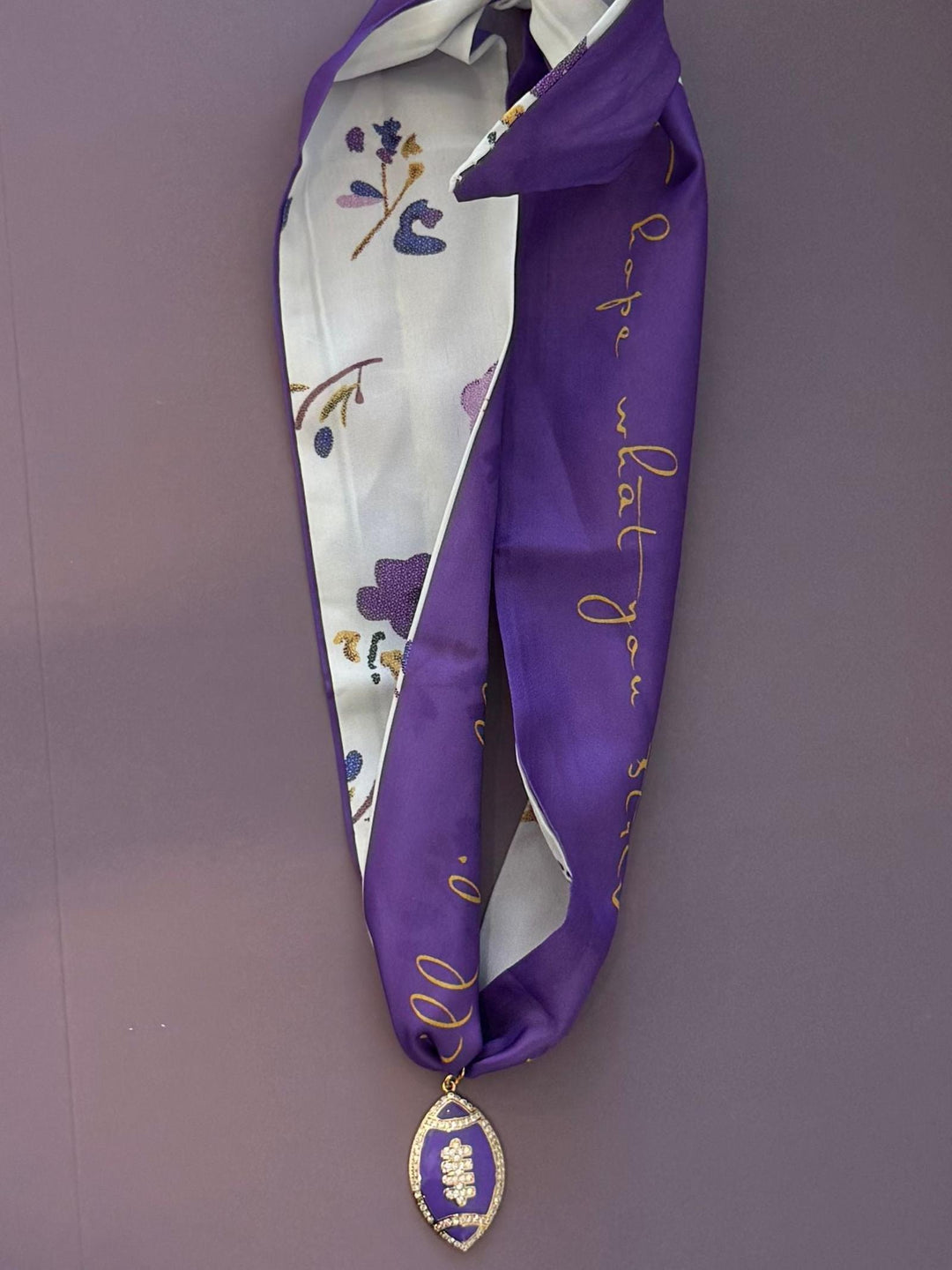 purple and floral football necklace