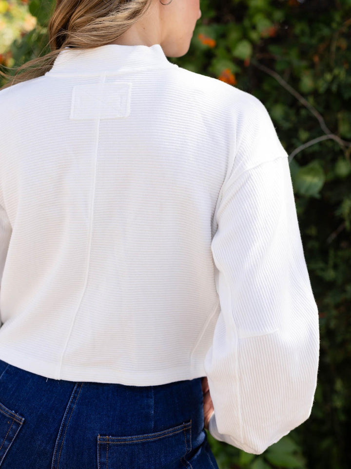 Free People Celeste Quarter Zip in Clean Ivory, a ribbed cotton mock neck with drop shoulders.