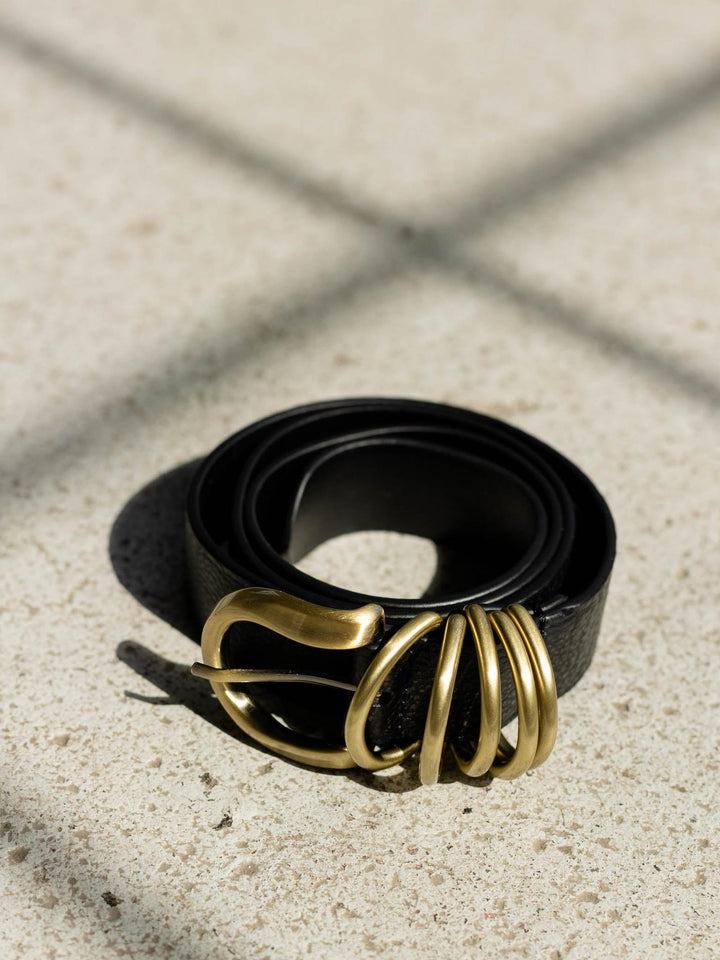 black and gold textured belt