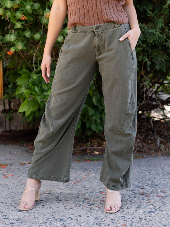 Free People Spotlight Washed Trouser in Dusty Olive, featuring an articulated barrel leg and slouchy fit.