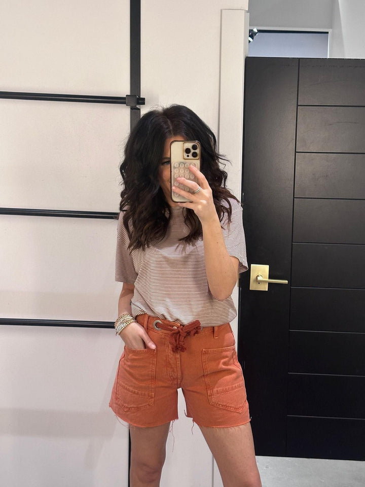 orange distressed denim shorts