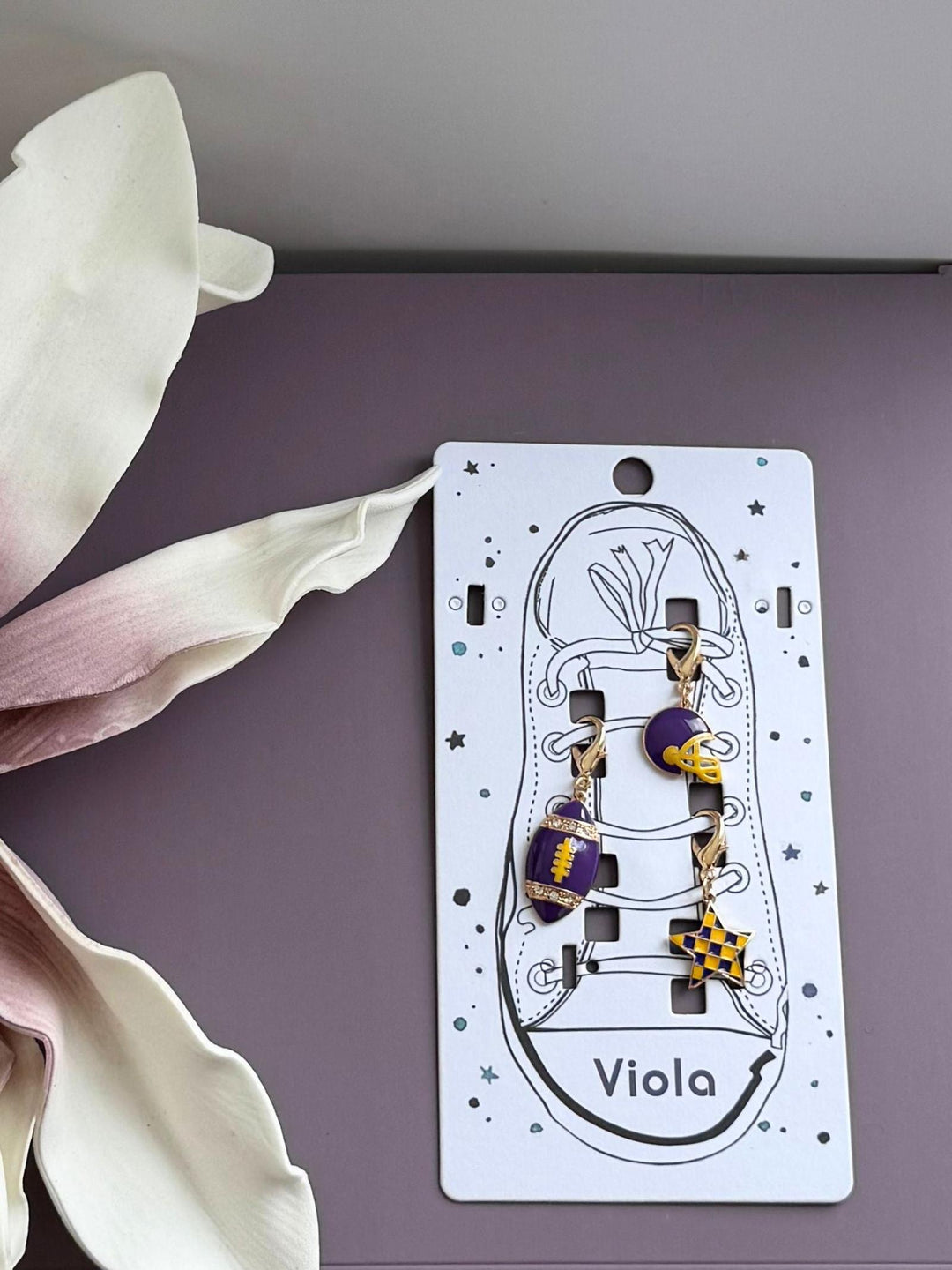 purple and yellow game day charms