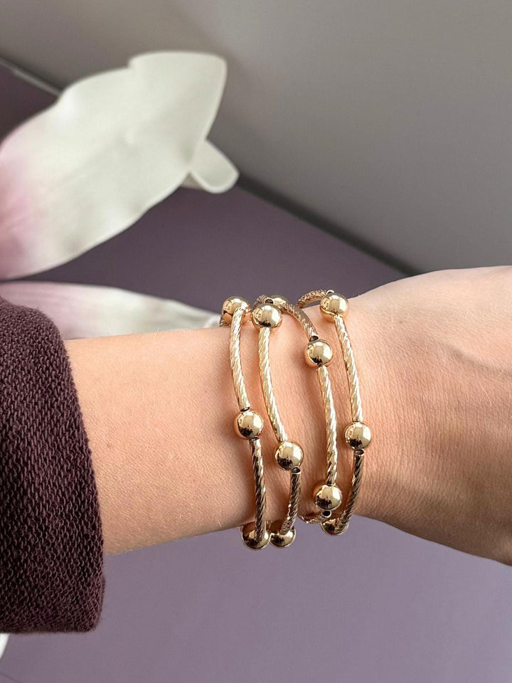 gold metal ball bracelets