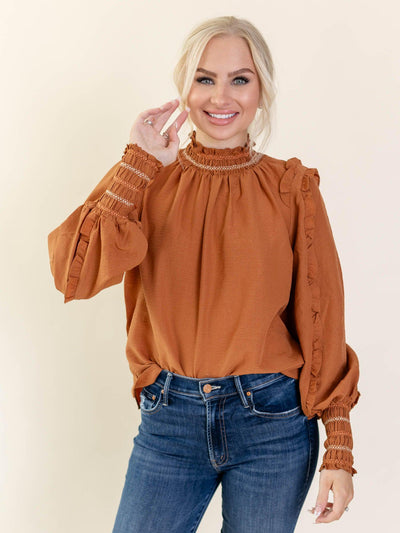 textured orange blouse