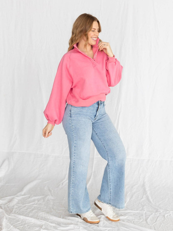 pink half button pullover with puff sleeves