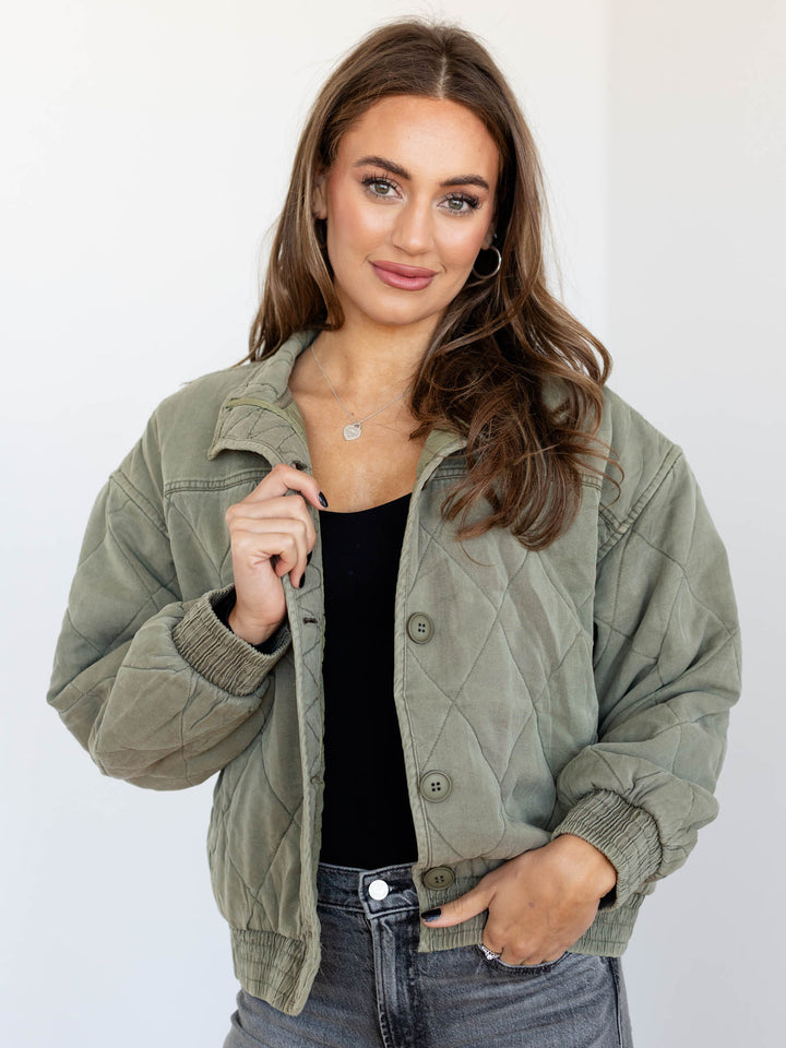 washed green quilted bomber jacket