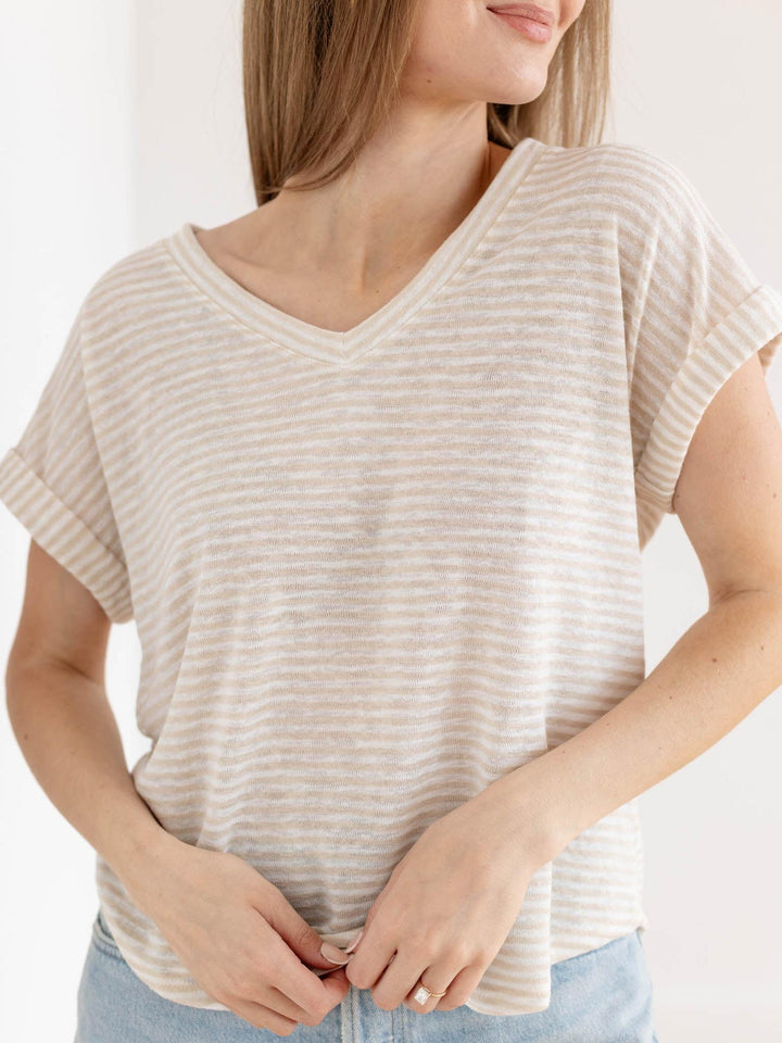 tan and white v neck tee