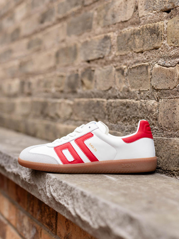 White BACK 70 Cloud Sneaker with red stripes and heel accent, light grey suede toe, and gum sole.