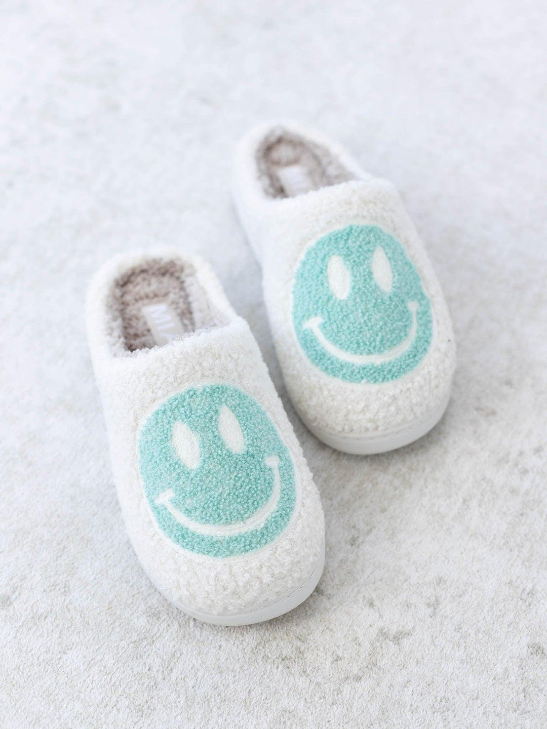 teal smiley slippers